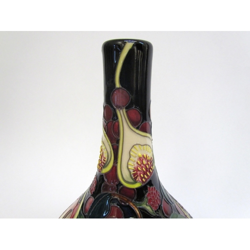 7554 - A Moorcroft Queen's Choice pattern vase with slender neck by Emma Bossons. Second, 28cm tall