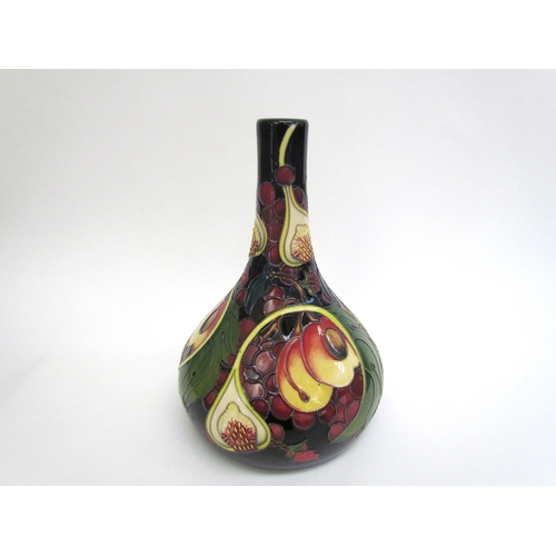 7554 - A Moorcroft Queen's Choice pattern vase with slender neck by Emma Bossons. Second, 28cm tall