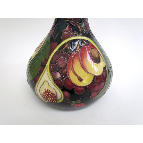 7554 - A Moorcroft Queen's Choice pattern vase with slender neck by Emma Bossons. Second, 28cm tall