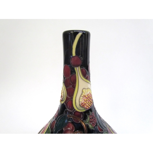 7554 - A Moorcroft Queen's Choice pattern vase with slender neck by Emma Bossons. Second, 28cm tall