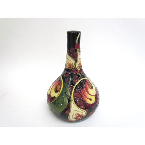 7554 - A Moorcroft Queen's Choice pattern vase with slender neck by Emma Bossons. Second, 28cm tall