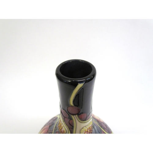 7554 - A Moorcroft Queen's Choice pattern vase with slender neck by Emma Bossons. Second, 28cm tall