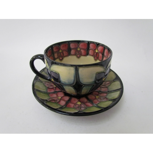 7556 - A Moorcroft Violet pattern tea service for two