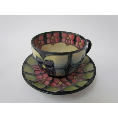 7556 - A Moorcroft Violet pattern tea service for two