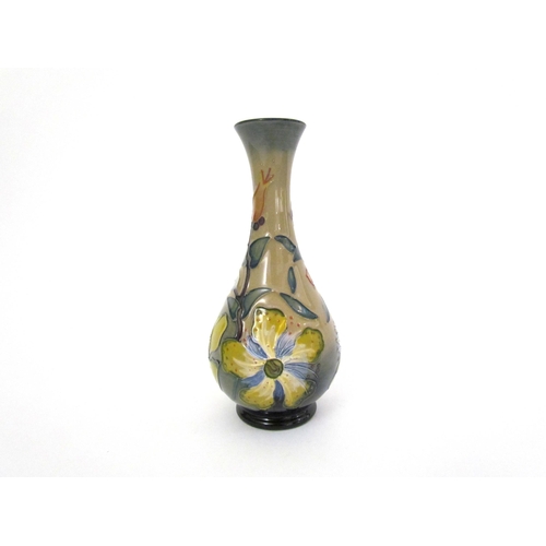 7559 - A Moorcroft Hypericum pattern vase, dated '93, 17cm tall