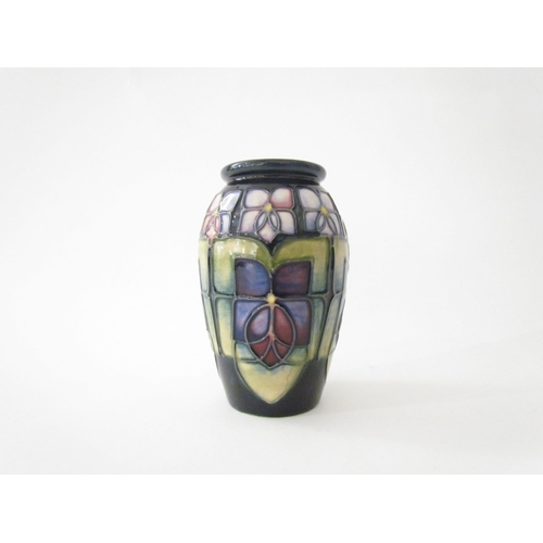 7561 - A Moorcroft Violet pattern vase of small proportions, 11cm tall