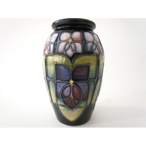 7561 - A Moorcroft Violet pattern vase of small proportions, 11cm tall