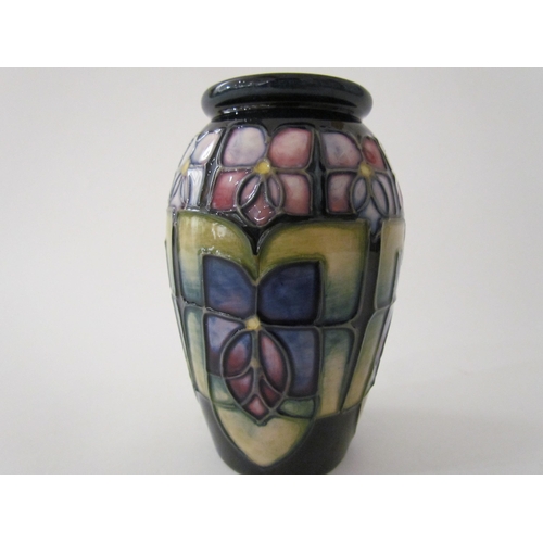 7561 - A Moorcroft Violet pattern vase of small proportions, 11cm tall