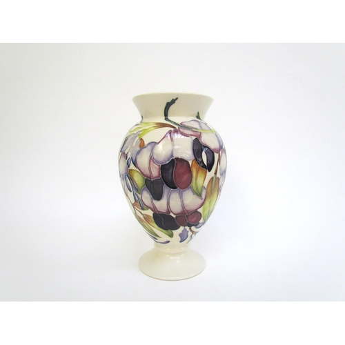 7563 - A Moorcroft vase designed by Emma Bossons, Purple Wisteria, 18cm tall  (R)  £60