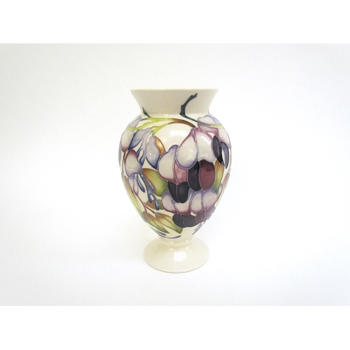 7563 - A Moorcroft vase designed by Emma Bossons, Purple Wisteria, 18cm tall  (R)  £60