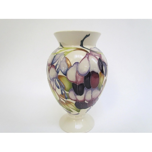 7563 - A Moorcroft vase designed by Emma Bossons, Purple Wisteria, 18cm tall  (R)  £60