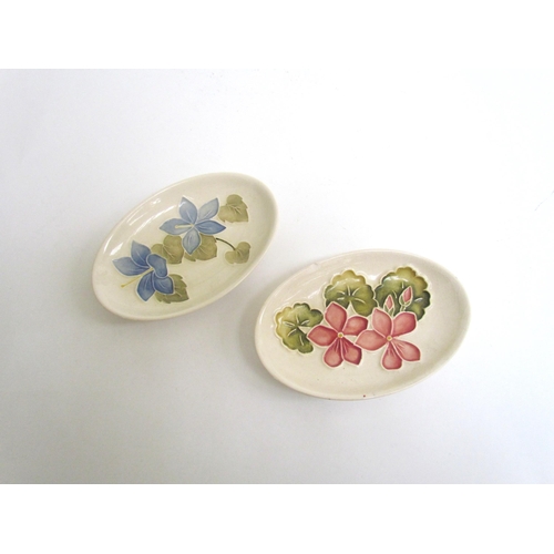 7568 - Two Moorcroft oval pin dishes, blue and pink Campanula, one chipped