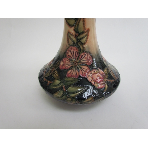 7569 - A Moorcroft Sweetbriar pattern vase, 21cm tall