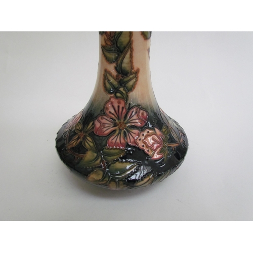 7569 - A Moorcroft Sweetbriar pattern vase, 21cm tall