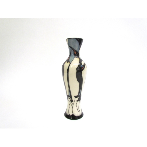 7571 - A Moorcroft Pole to Pole pattern vase with Penguin design, 21cm tall