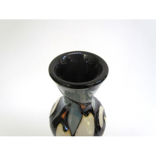 7571 - A Moorcroft Pole to Pole pattern vase with Penguin design, 21cm tall