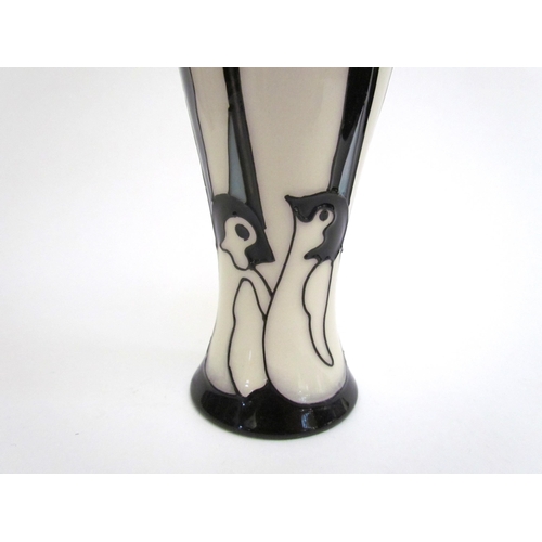 7571 - A Moorcroft Pole to Pole pattern vase with Penguin design, 21cm tall