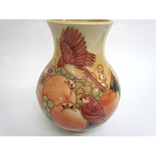 7578 - A Moorcroft Finches and Berries on ochre vase, 23.5cm tall