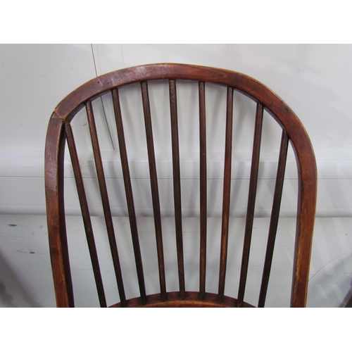 7591 - A pair of circa 1800 his and hers Windsor chairs, the hoop and stick-back over a solid elm seat, on ... 