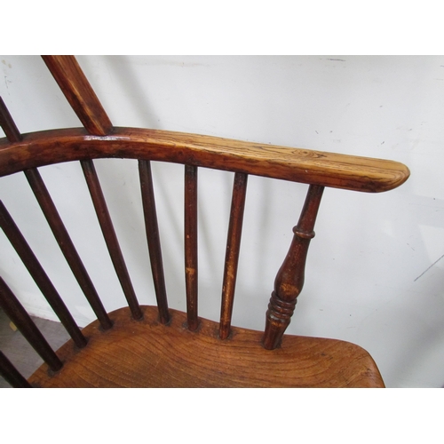 7591 - A pair of circa 1800 his and hers Windsor chairs, the hoop and stick-back over a solid elm seat, on ... 