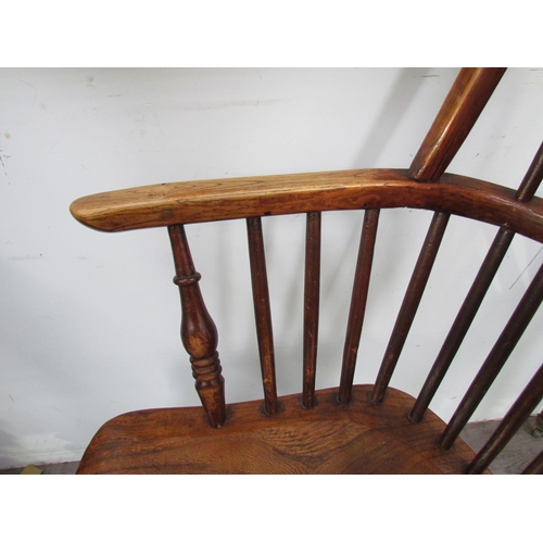 7591 - A pair of circa 1800 his and hers Windsor chairs, the hoop and stick-back over a solid elm seat, on ... 