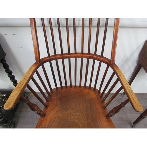 7591 - A pair of circa 1800 his and hers Windsor chairs, the hoop and stick-back over a solid elm seat, on ... 