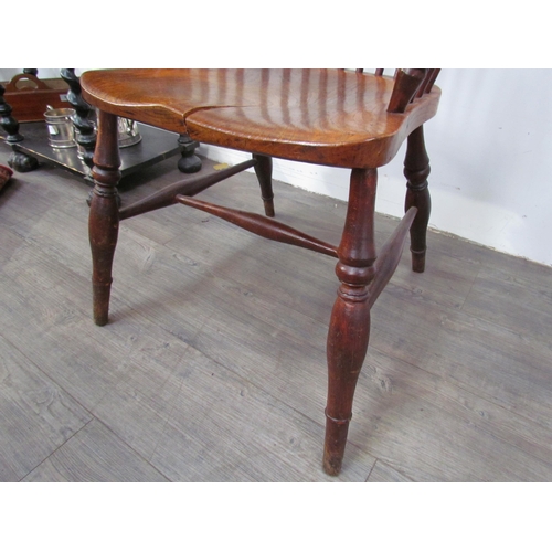 7591 - A pair of circa 1800 his and hers Windsor chairs, the hoop and stick-back over a solid elm seat, on ... 