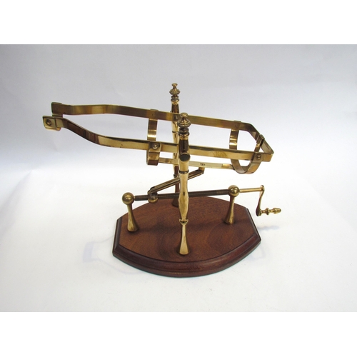 7593 - A brass Port decanter, hardwood base