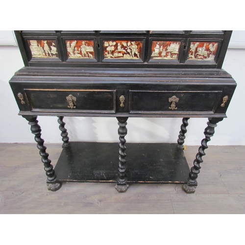 7594 - An 18th Century European cabinet on stand, the spindle rail cornice over an eight drawer and single ... 