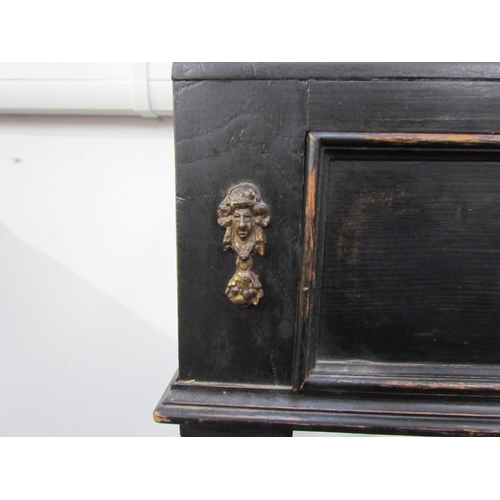 7594 - An 18th Century European cabinet on stand, the spindle rail cornice over an eight drawer and single ... 