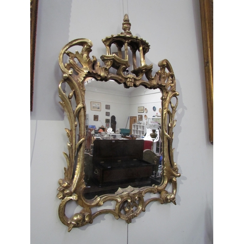 7595 - A Chippendale style mirror with later mirror plate, 66cm high