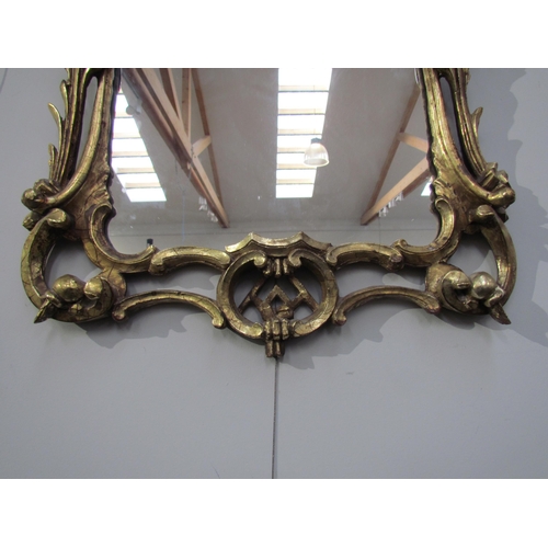 7595 - A Chippendale style mirror with later mirror plate, 66cm high