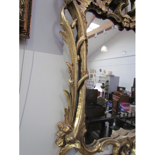 7595 - A Chippendale style mirror with later mirror plate, 66cm high