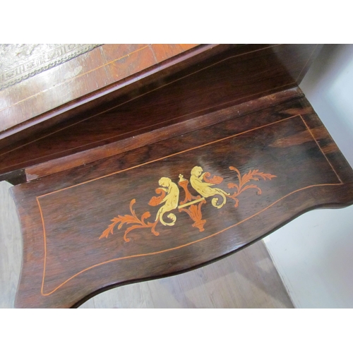 7599 - A 19th Century rosewood veneer desk inlaid with scrolled marquetry including ivory, cut glass mirror... 