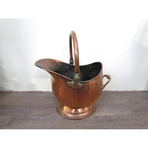 7600 - A Victorian copper helmet form coal scuttle