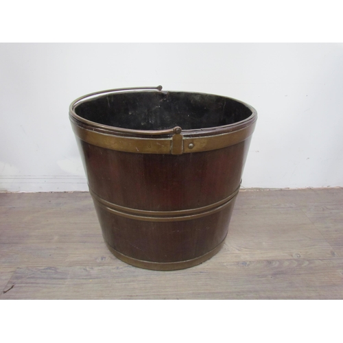 7605 - A 19th Century bentwood bucket with brass banding, 32cm high