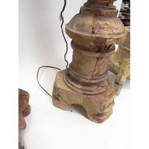 7019 - Three 19th Century carved wood lamp bases in a rustic condition, 94cm, 76cm and 73cm tall