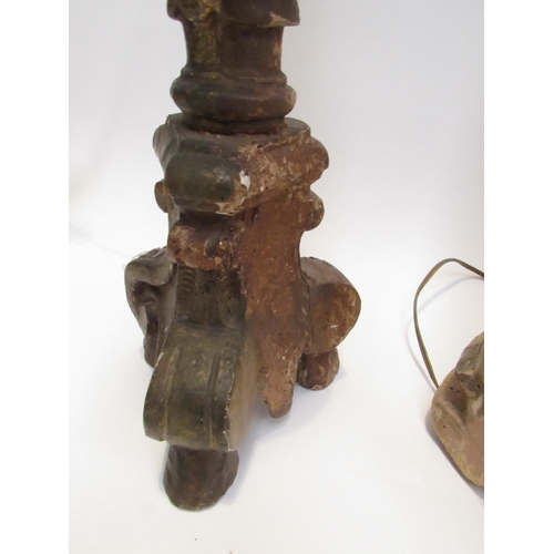 7019 - Three 19th Century carved wood lamp bases in a rustic condition, 94cm, 76cm and 73cm tall