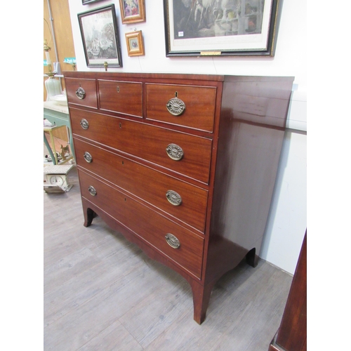 7022 - A Regency mahogany chest of three over three drawers with embossed oval plate handles, shaped apron,... 