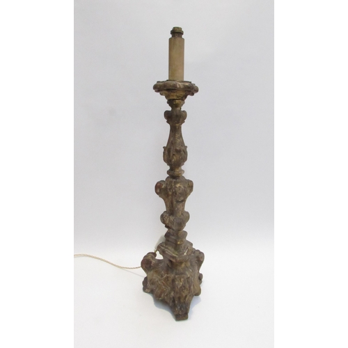 7027 - An 19th Century gilded wood pricket candlesticks converted to electricity with weighted lead to base... 