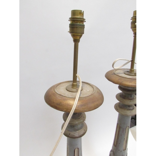 7039 - A pair of carved wood painted tall lamps with slender bodies to bulbous bases,78cm tall