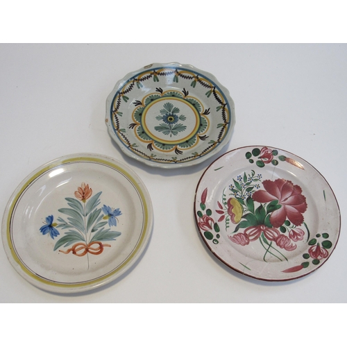 7050 - A collection of 19th Century French Faience plates decorated with flower and leaves, six with visibl... 