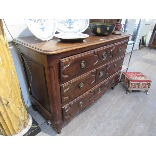 7066 - WITHDRAWN: A 19th Century French walnut chest of three long drawers with carved detail to drawer fro... 