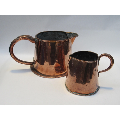 7075 - Two 19th Century copper jugs of barrel for, 15.5 cm and 18.5cm tall