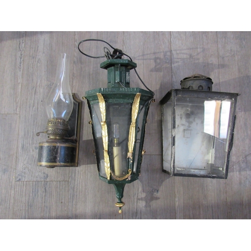 7080 - A 19th Century cast iron wall lantern with gilt embellishment, tin wall hanging oil lamp and further... 