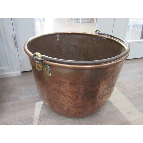 7081 - A large copper copper with wrought metal handle, 40cm tall x 59cm diameter   (R) £150 ARCH SALE