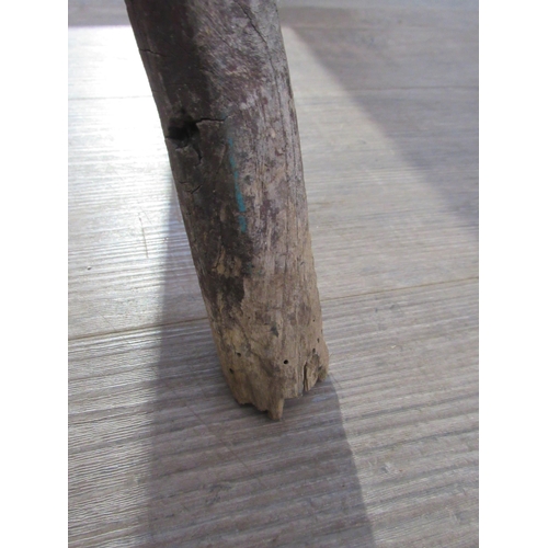 7082 - A primitive 18th Century Elm cricket table with thick circular top on three rustic legs. 53cm tall x... 