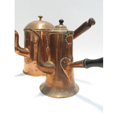 7084 - A Victorian large copper coffee pot with treen handle and another with ebony handle of smaller form.... 