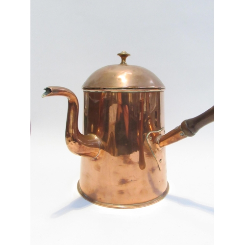 7084 - A Victorian large copper coffee pot with treen handle and another with ebony handle of smaller form.... 