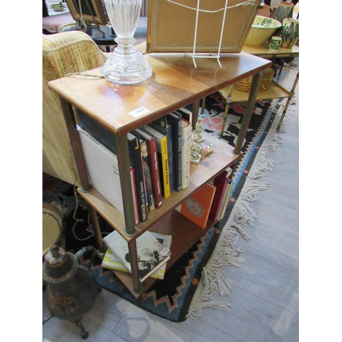 7097 - A late 19th Century French three tier bookcase with brass column supports (sun damaged), 85cm x 58cm... 